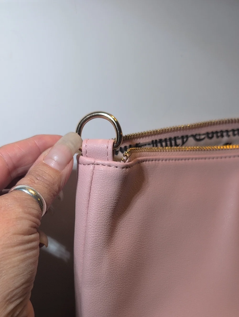 Juicy Couture Light Pink Vegan Leather Clutch Bag With Gold Hardware.